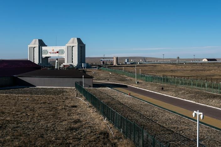  A border crossing with Russia in Manzhouli, China, marked by two arches and divided on the Chinese side by a green wire fence that stretches for hundreds of miles, on Dec. 7, 2018. (Lam Yik Fei/The New York Times)